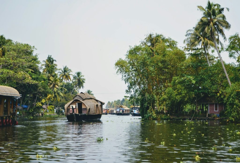 brown wooden house on lake during daytime