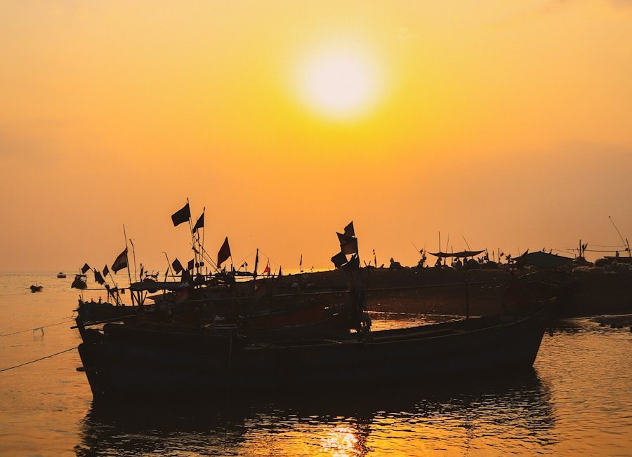 silhouette of people riding on boat during sunset